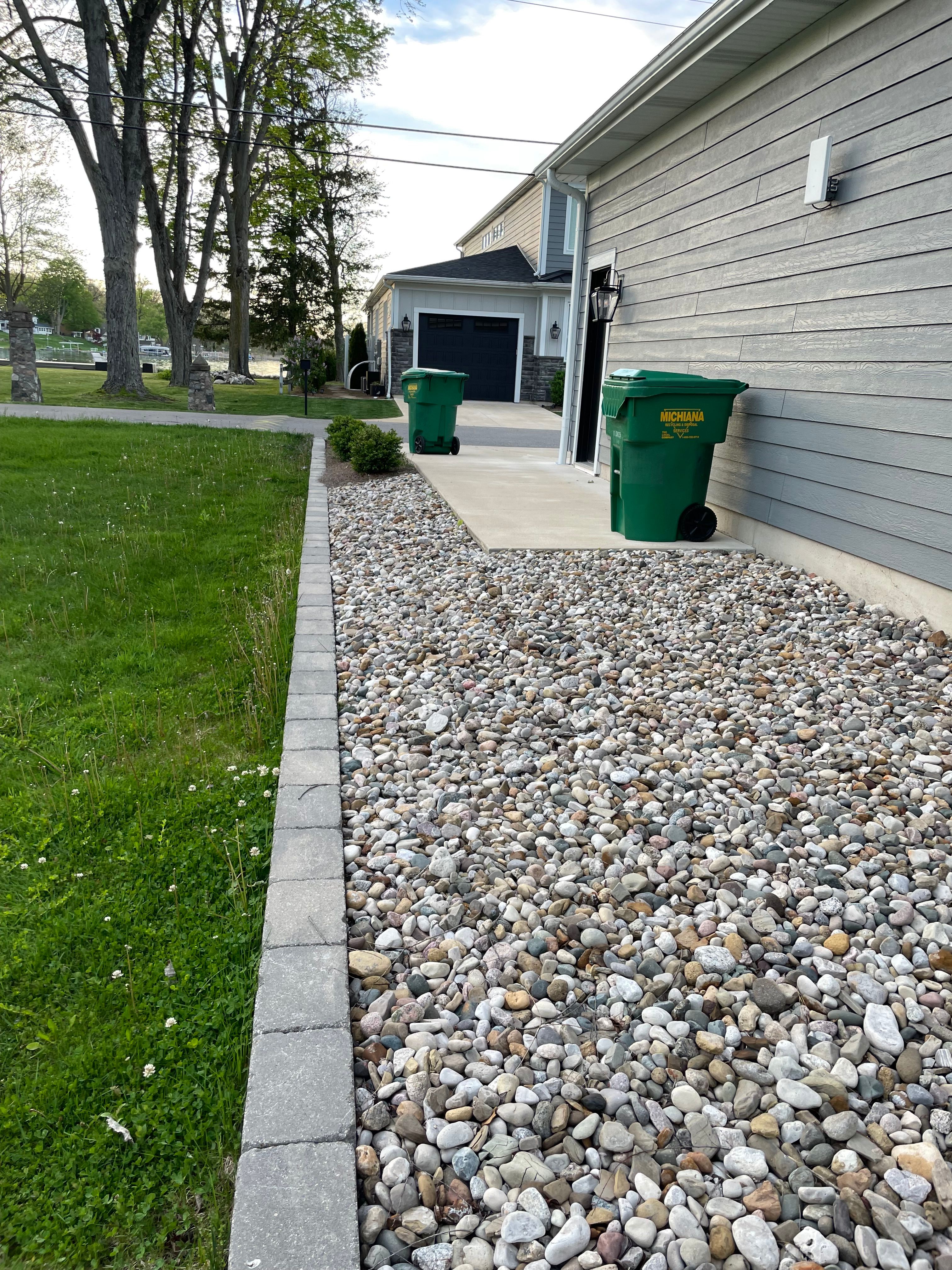 Retaining wall with natural stone face