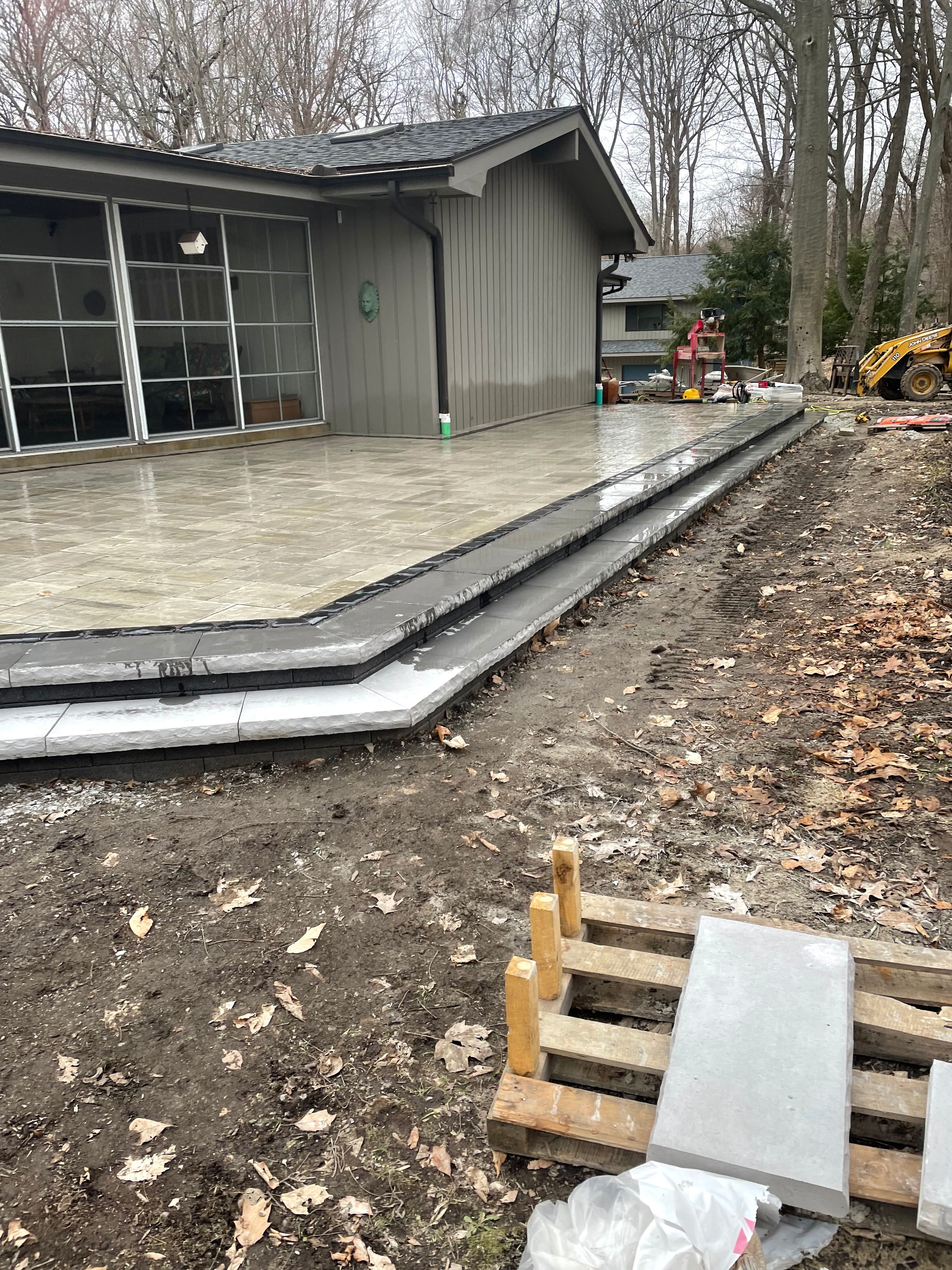 Boulder retaining wall installation