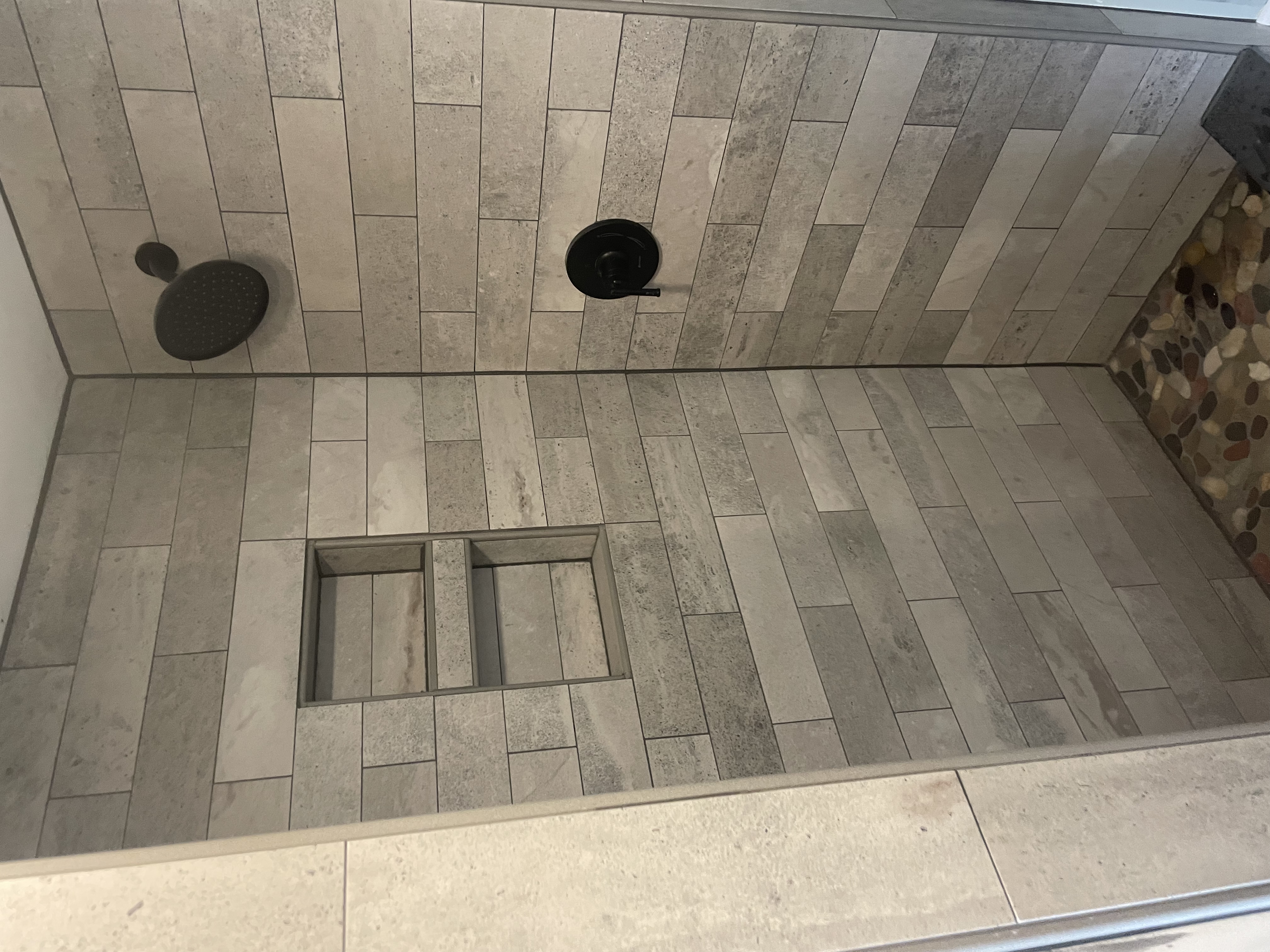 Custom tile shower with niche and bench